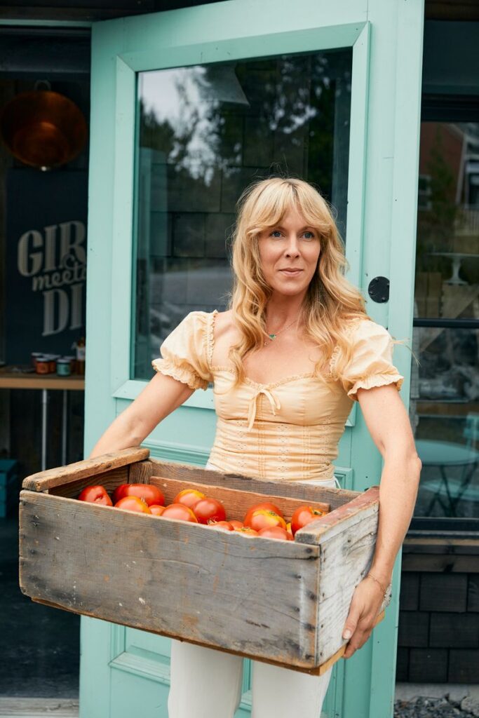 Audra Lawlor holding basket of fruit for Girl Meets Dirt